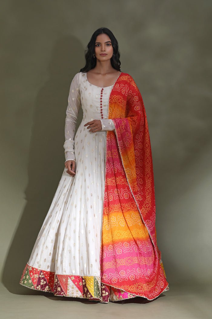 Buy beautiful white floorlength Anarkali suit online in USA with multicolor border. Look your best at weddings and parties in Indian dresses, designer lehengas, Anarkali suits, designer gowns, salwar suits, sharara suits from Pure Elegance Indian fashion store in USA.-full view