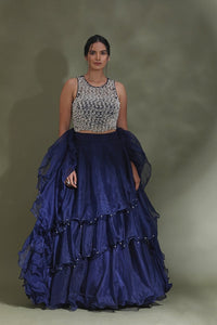 Buy beautiful dark blue ruffle lehenga online in USA with embellished blouse with dupatta. Look your best at weddings and parties in Indian dresses, designer lehengas, Anarkali suits, designer gowns, salwar suits, sharara suits from Pure Elegance Indian fashion store in USA.-full view