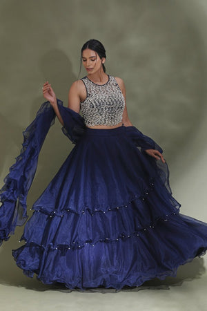 Buy beautiful dark blue ruffle lehenga online in USA with embellished blouse with dupatta. Look your best at weddings and parties in Indian dresses, designer lehengas, Anarkali suits, designer gowns, salwar suits, sharara suits from Pure Elegance Indian fashion store in USA.-lehenga