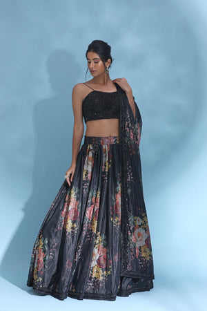 Buy stunning black floral lehenga online in USA with sequin blouse and dupatta. Look your best at weddings and parties in Indian dresses, designer lehengas, Anarkali suits, designer gowns, salwar suits, sharara suits from Pure Elegance Indian fashion store in USA.-side