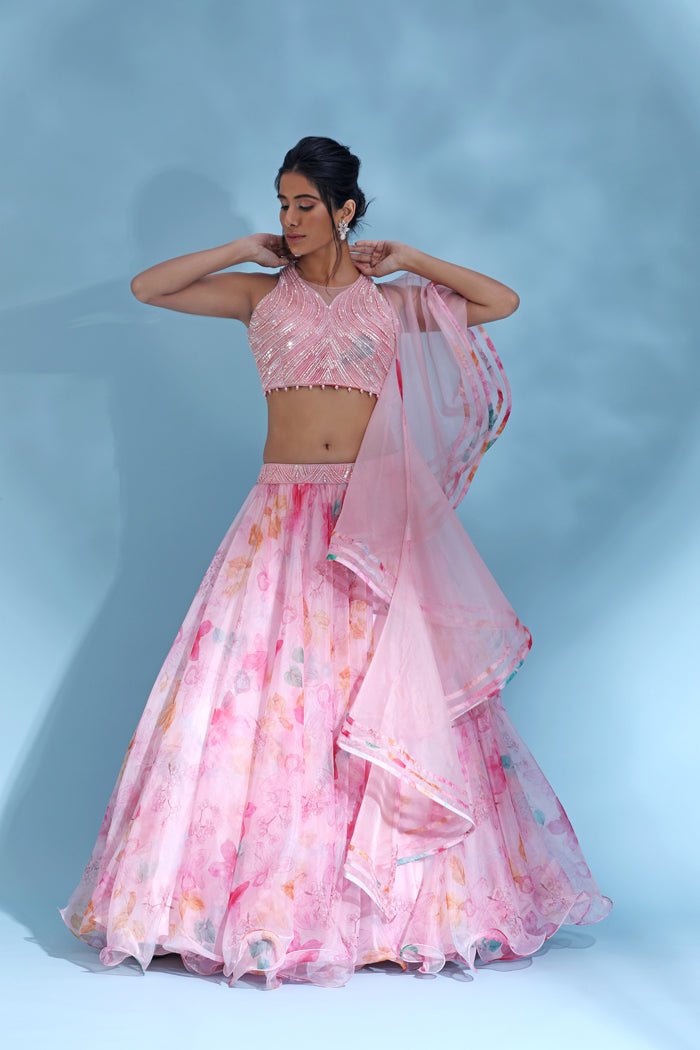 Buy beautiful light pink floral designer lehenga online in USA with dupatta. Look your best at weddings and parties in Indian dresses, designer lehengas, Anarkali suits, designer gowns, salwar suits, sharara suits from Pure Elegance Indian fashion store in USA.-front