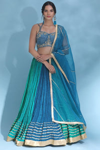 Shop stunning blue and green designer lehenga online in USA with dupatta. Look your best at weddings and parties in Indian dresses, designer lehengas, Anarkali suits, designer gowns, salwar suits, sharara suits from Pure Elegance Indian fashion store in USA.-full view