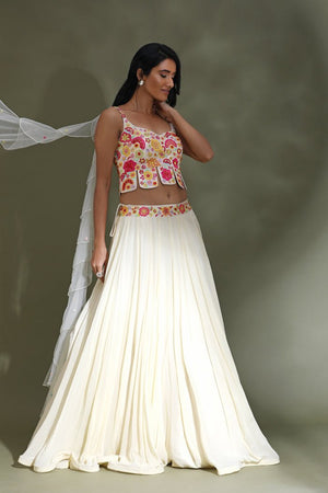 Buy stunning off-white lehenga online in USA with multicolor embroidery blouse. Look your best at weddings and parties in Indian dresses, designer lehengas, Anarkali suits, designer gowns, salwar suits, sharara suits from Pure Elegance Indian fashion store in USA.-side