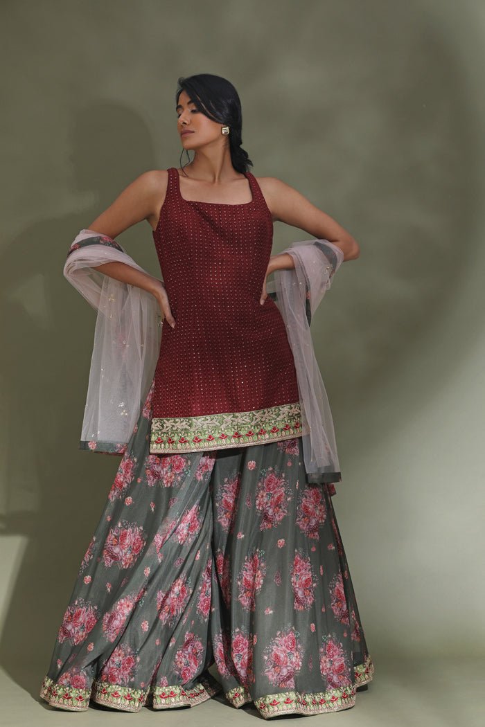 Buy beautiful maroon and grey floral embroidered sharara suit online in USA with dupatta. Look your best at weddings and parties in Indian dresses, designer lehengas, Anarkali suits, designer gowns, salwar suits, sharara suits from Pure Elegance Indian fashion store in USA.-full view