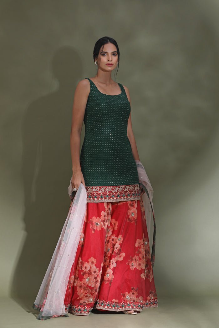 Shop beautiful green and red floral embroidered sharara suit online in USA with dupatta. Look your best at weddings and parties in Indian dresses, designer lehengas, Anarkali suits, designer gowns, salwar suits, sharara suits from Pure Elegance Indian fashion store in USA.-side