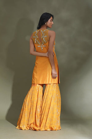 Buy stunning yellow embroidered gharara suit online in USA with dupatta. Look your best at weddings and parties in Indian dresses, designer lehengas, Anarkali suits, designer gowns, salwar suits, sharara suits from Pure Elegance Indian fashion store in USA.-back