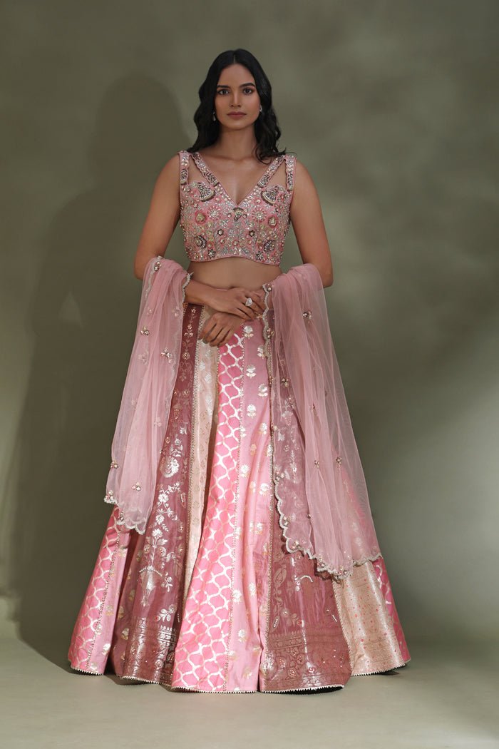 Buy beautiful pink embroidered contemporary designer lehenga online in USA with dupatta. Look your best at weddings and parties in Indian dresses, designer lehengas, Anarkali suits, designer gowns, salwar suits, sharara suits from Pure Elegance Indian fashion store in USA.-full view