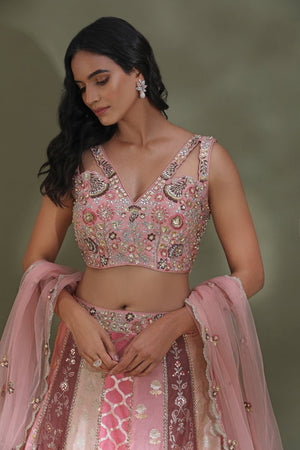 Buy beautiful pink embroidered contemporary designer lehenga online in USA with dupatta. Look your best at weddings and parties in Indian dresses, designer lehengas, Anarkali suits, designer gowns, salwar suits, sharara suits from Pure Elegance Indian fashion store in USA.-closeup
