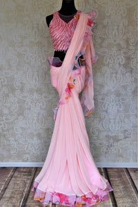 Shop beautiful light pink printed ruffle saree online in USA with pearl work blouse. Look your best at weddings and parties in Indian sarees, designer saris, printed sarees, embroidered sarees from Pure Elegance Indian fashion store in USA.-full view