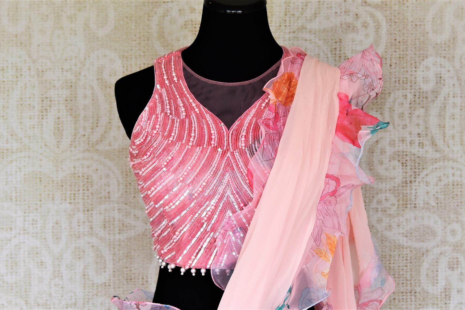 Shop beautiful light pink printed ruffle saree online in USA with pearl work blouse. Look your best at weddings and parties in Indian sarees, designer saris, printed sarees, embroidered sarees from Pure Elegance Indian fashion store in USA.-blouse