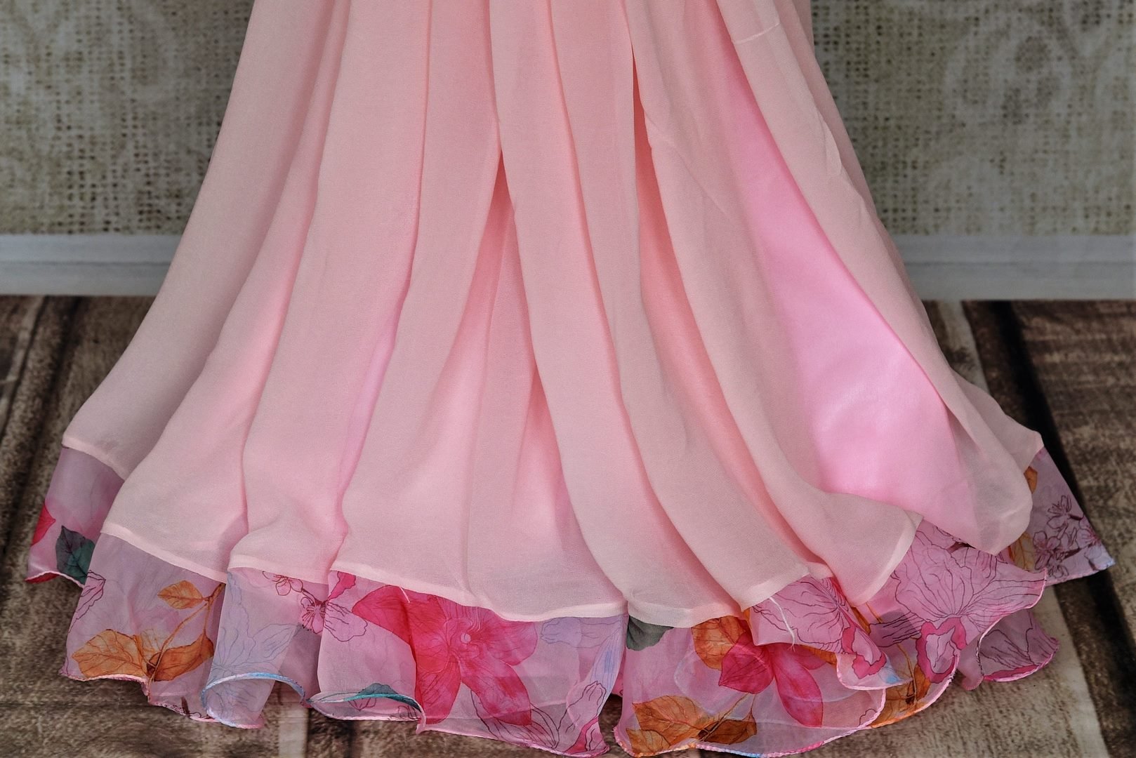 Shop beautiful light pink printed ruffle saree online in USA with pearl work blouse. Look your best at weddings and parties in Indian sarees, designer saris, printed sarees, embroidered sarees from Pure Elegance Indian fashion store in USA.-pleats