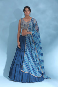 Shop powder pink contemporary lehenga online in USA with dupatta. Look your best at weddings and parties in Indian dresses, designer lehengas, Anarkali suits, designer gowns, salwar suits, sharara suits from Pure Elegance Indian fashion store in USA.-full view