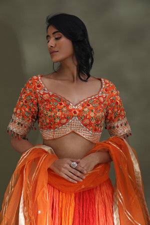 Shop beautiful orange and red lehenga online in USA with gota border and dupatta. Look your best at weddings and parties in Indian dresses, designer lehengas, Anarkali suits, designer gowns, salwar suits, sharara suits from Pure Elegance Indian fashion store in USA.-closeup