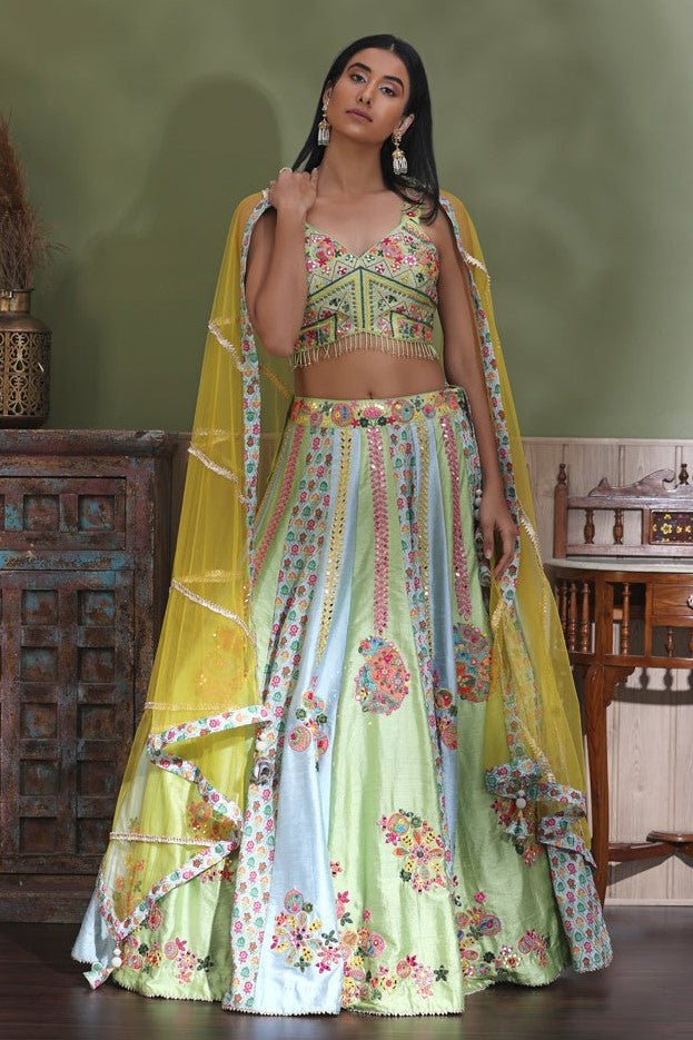 Shop stunning pastel green embroidered lehenga online in USA with yellow dupatta. Look your best at weddings and parties in Indian dresses, designer lehengas, Anarkali suits, designer gowns, salwar suits, sharara suits from Pure Elegance Indian fashion store in USA.-full view