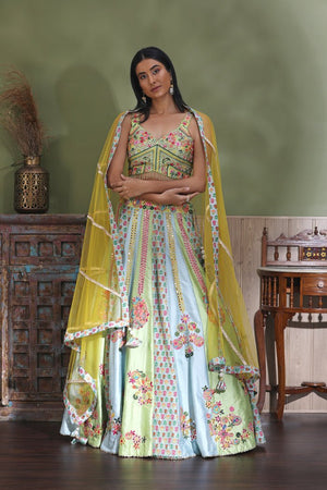 Shop stunning pastel green embroidered lehenga online in USA with yellow dupatta. Look your best at weddings and parties in Indian dresses, designer lehengas, Anarkali suits, designer gowns, salwar suits, sharara suits from Pure Elegance Indian fashion store in USA.-front