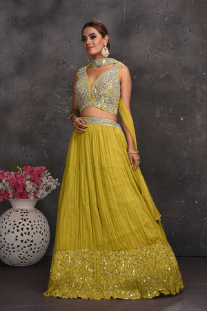 Shop beautiful pista green mirror work lehenga online in USA with dupatta. Look your best at weddings and special occasions in exclusive designer lehengas, Anarkali suits, sharara suits. designer gowns and Indian dresses from Pure Elegance Indian fashion store in USA.-side