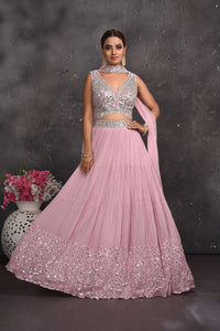 Buy stunning powder pink mirror work lehenga online in USA with dupatta. Look your best at weddings and special occasions in exclusive designer lehengas, Anarkali suits, sharara suits. designer gowns and Indian dresses from Pure Elegance Indian fashion store in USA.-full view