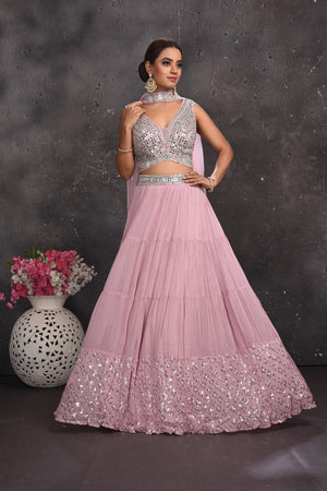Buy stunning powder pink mirror work lehenga online in USA with dupatta. Look your best at weddings and special occasions in exclusive designer lehengas, Anarkali suits, sharara suits. designer gowns and Indian dresses from Pure Elegance Indian fashion store in USA.-front