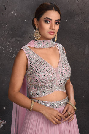 Buy stunning powder pink mirror work lehenga online in USA with dupatta. Look your best at weddings and special occasions in exclusive designer lehengas, Anarkali suits, sharara suits. designer gowns and Indian dresses from Pure Elegance Indian fashion store in USA.-closeup