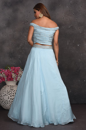 Buy beautiful powder blue off-shoulder lehenga online in USA with ruffle dupatta. Look your best at weddings and special occasions in exclusive designer lehengas, Anarkali suits, sharara suits. designer gowns and Indian dresses from Pure Elegance Indian fashion store in USA.-back
