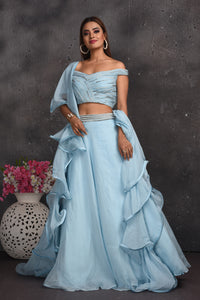 Buy beautiful powder blue off-shoulder lehenga online in USA with ruffle dupatta. Look your best at weddings and special occasions in exclusive designer lehengas, Anarkali suits, sharara suits. designer gowns and Indian dresses from Pure Elegance Indian fashion store in USA.-full view