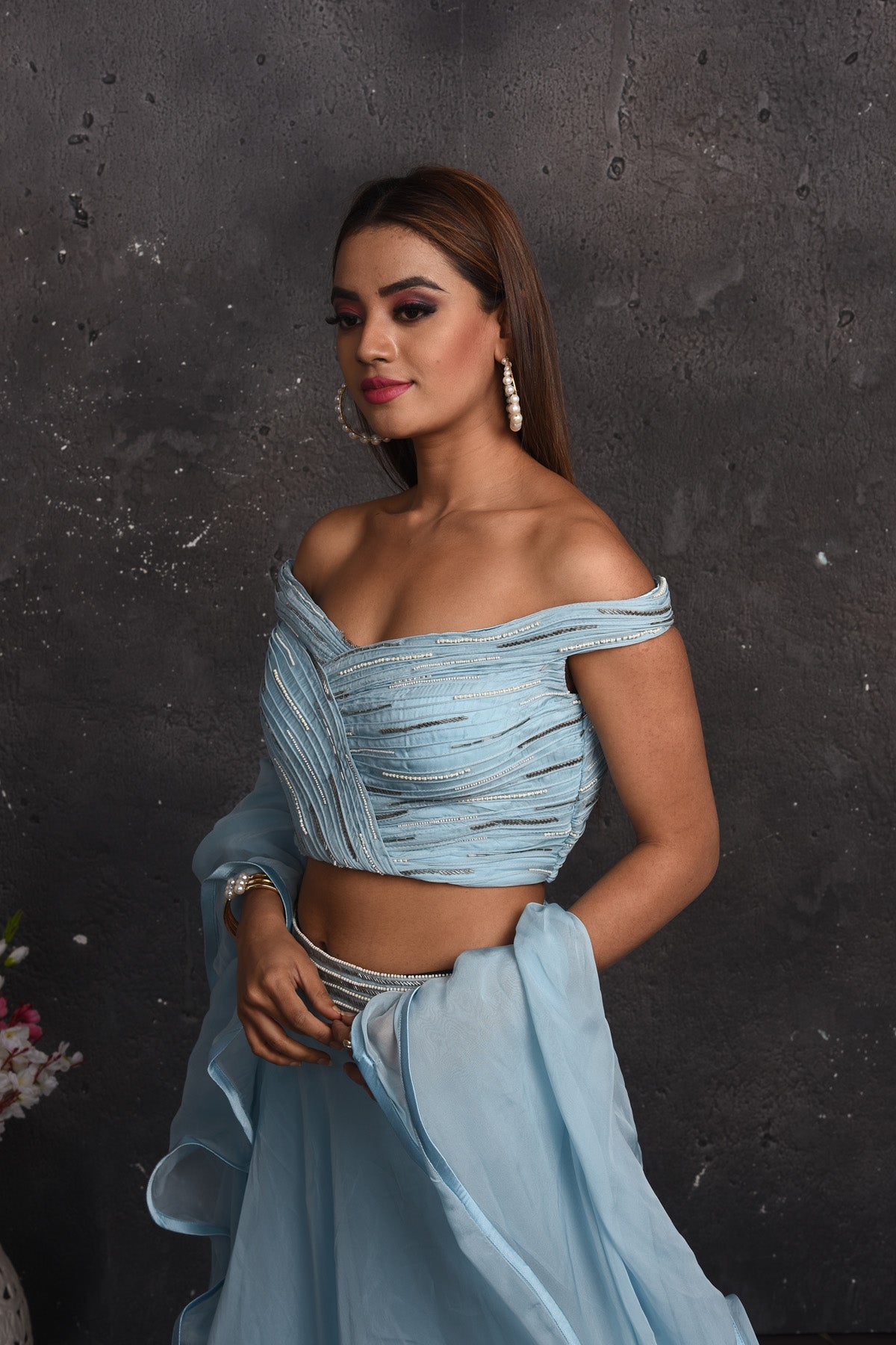 Buy beautiful powder blue off-shoulder lehenga online in USA with ruffle dupatta. Look your best at weddings and special occasions in exclusive designer lehengas, Anarkali suits, sharara suits. designer gowns and Indian dresses from Pure Elegance Indian fashion store in USA.-closeup