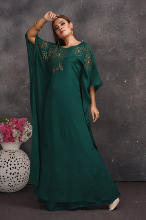 Shop stunning dark green kaftaan gown online in USA. Look your best at weddings and special occasions in exclusive designer lehengas, Anarkali suits, sharara suits. designer gowns and Indian dresses from Pure Elegance Indian fashion store in USA.-side