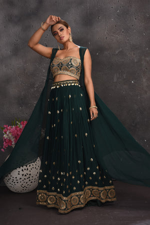 Shop beautiful dark green embroidered palazzo crop top online in USA with longline shrug. Look your best at weddings and special occasions in exclusive designer lehengas, Anarkali suits, sharara suits. designer gowns and Indian dresses from Pure Elegance Indian fashion store in USA.-side