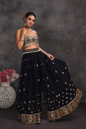Buy stunning navy blue embroidered palazzo crop top online in USA with longline shrug. Look your best at weddings and special occasions in exclusive designer lehengas, Anarkali suits, sharara suits. designer gowns and Indian dresses from Pure Elegance Indian fashion store in USA.-palazzo