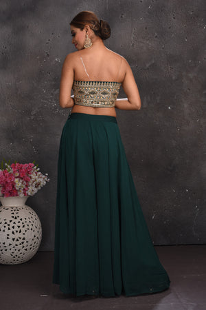 Shop stunning dark green embroidered palazzo crop top online in USA with cape. Look your best at weddings and special occasions in exclusive designer lehengas, Anarkali suits, sharara suits. designer gowns and Indian dresses from Pure Elegance Indian fashion store in USA.-back