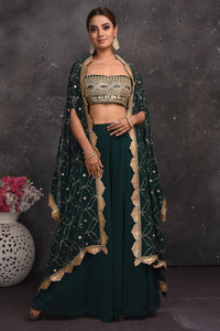 Shop stunning dark green embroidered palazzo crop top online in USA with cape. Look your best at weddings and special occasions in exclusive designer lehengas, Anarkali suits, sharara suits. designer gowns and Indian dresses from Pure Elegance Indian fashion store in USA.-full view
