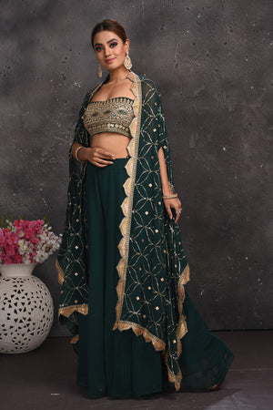 Shop stunning dark green embroidered palazzo crop top online in USA with cape. Look your best at weddings and special occasions in exclusive designer lehengas, Anarkali suits, sharara suits. designer gowns and Indian dresses from Pure Elegance Indian fashion store in USA.-side