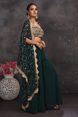 Shop stunning dark green embroidered palazzo crop top online in USA with cape. Look your best at weddings and special occasions in exclusive designer lehengas, Anarkali suits, sharara suits. designer gowns and Indian dresses from Pure Elegance Indian fashion store in USA.-right