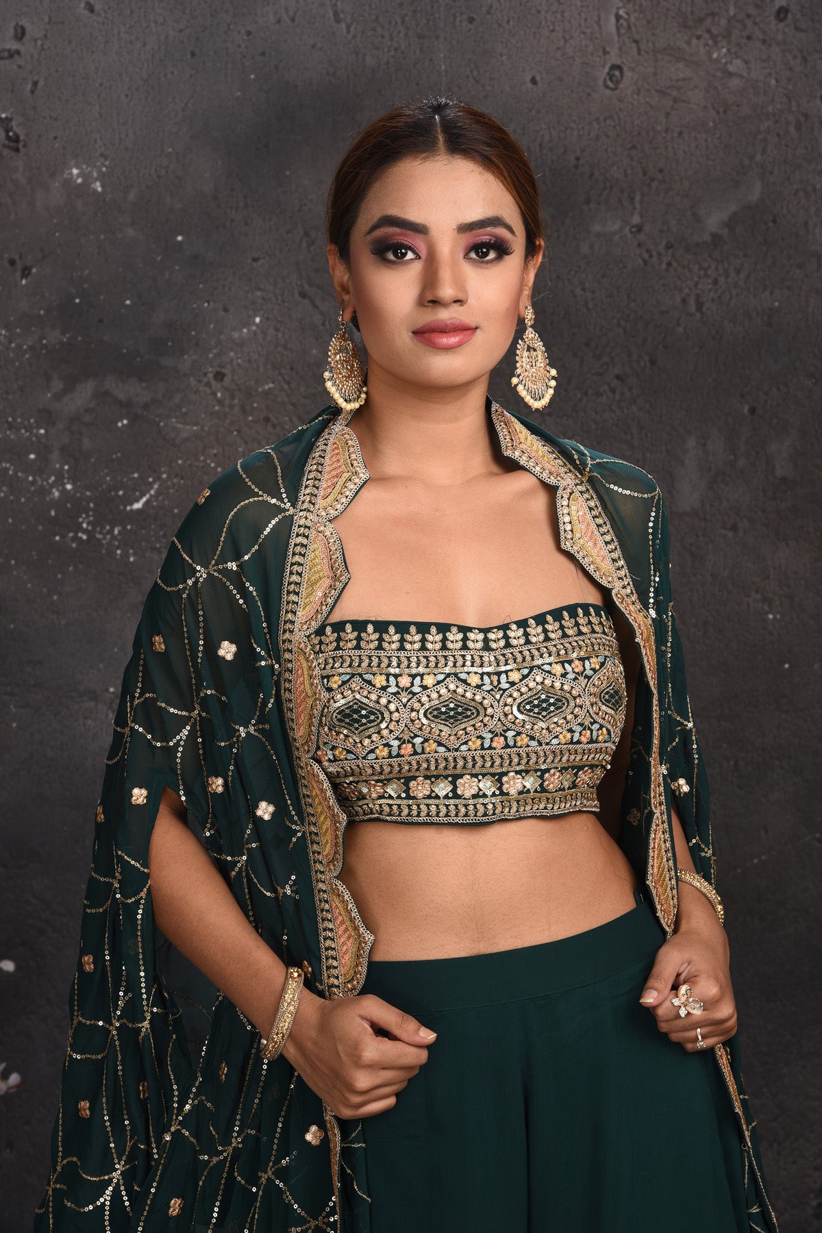 Shop stunning dark green embroidered palazzo crop top online in USA with cape. Look your best at weddings and special occasions in exclusive designer lehengas, Anarkali suits, sharara suits. designer gowns and Indian dresses from Pure Elegance Indian fashion store in USA.-closeup