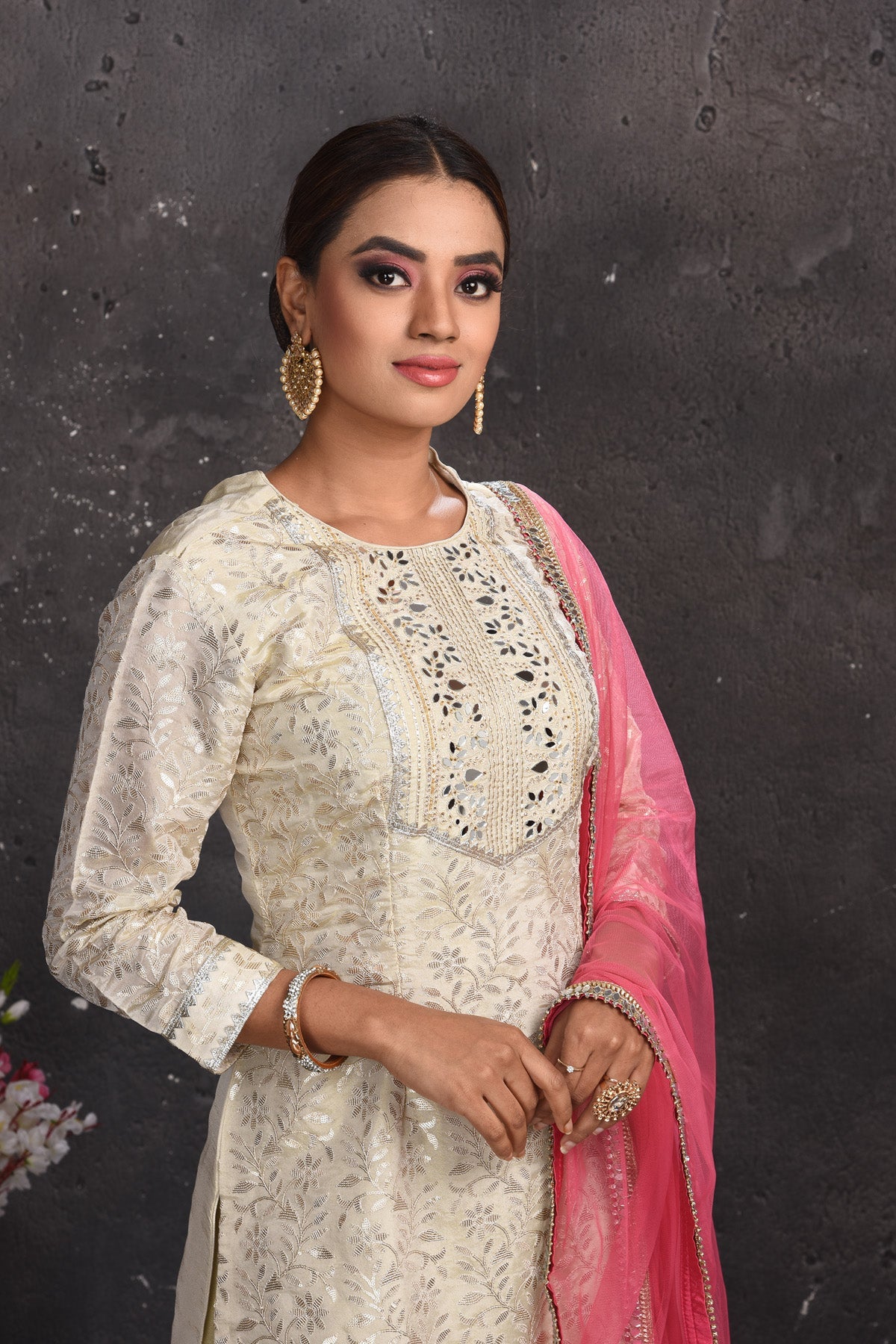 Shop beautiful off-white embroidered gharara suit online in USA with pink dupatta. Look your best at weddings and special occasions in exclusive designer lehengas, Anarkali suits, sharara suits. designer gowns and Indian dresses from Pure Elegance Indian fashion store in USA.-closeup