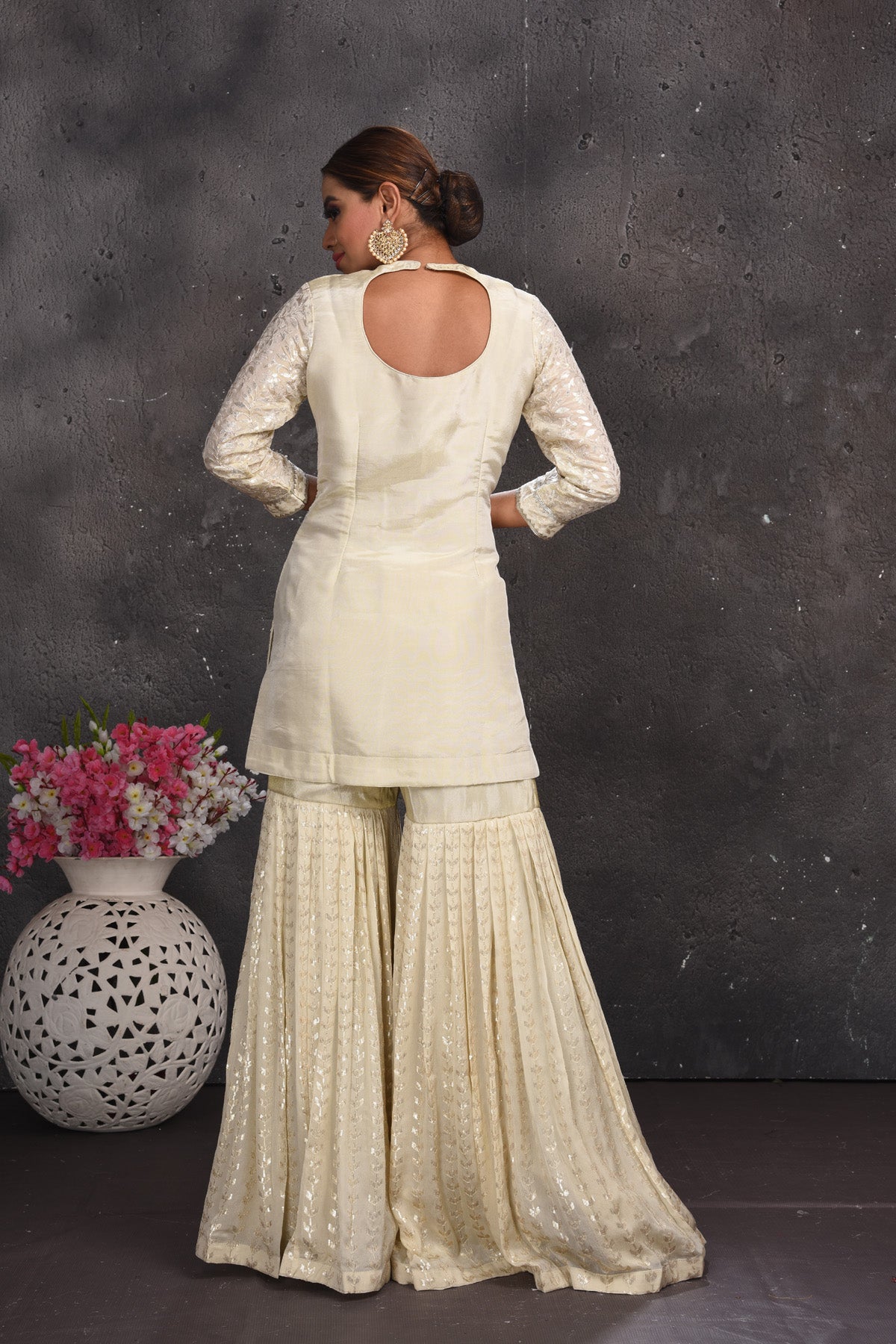 Shop beautiful off-white embroidered gharara suit online in USA with pink dupatta. Look your best at weddings and special occasions in exclusive designer lehengas, Anarkali suits, sharara suits. designer gowns and Indian dresses from Pure Elegance Indian fashion store in USA.-back