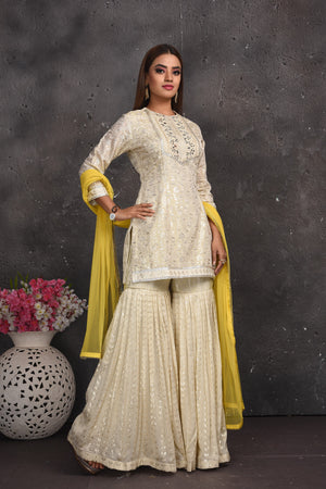 Shop gorgeous off-white embroidered gharara suit online in USA with yellow dupatta. Look your best at weddings and special occasions in exclusive designer lehengas, Anarkali suits, sharara suits. designer gowns and Indian dresses from Pure Elegance Indian fashion store in USA.-right