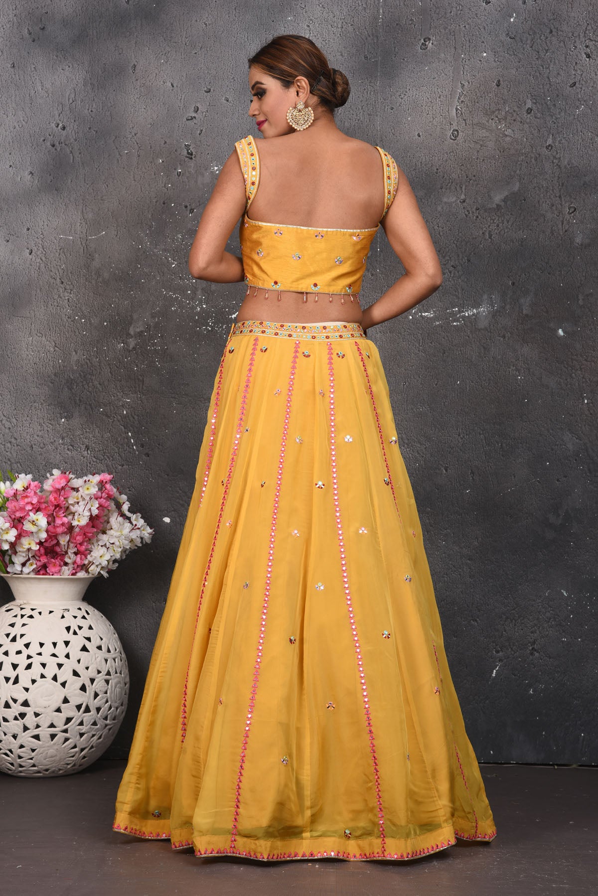 Buy beautiful mustard mirror work designer lehenga online in USA with dupatta. Look your best at weddings and special occasions in exclusive designer lehengas, Anarkali suits, sharara suits. designer gowns and Indian dresses from Pure Elegance Indian fashion store in USA.-back