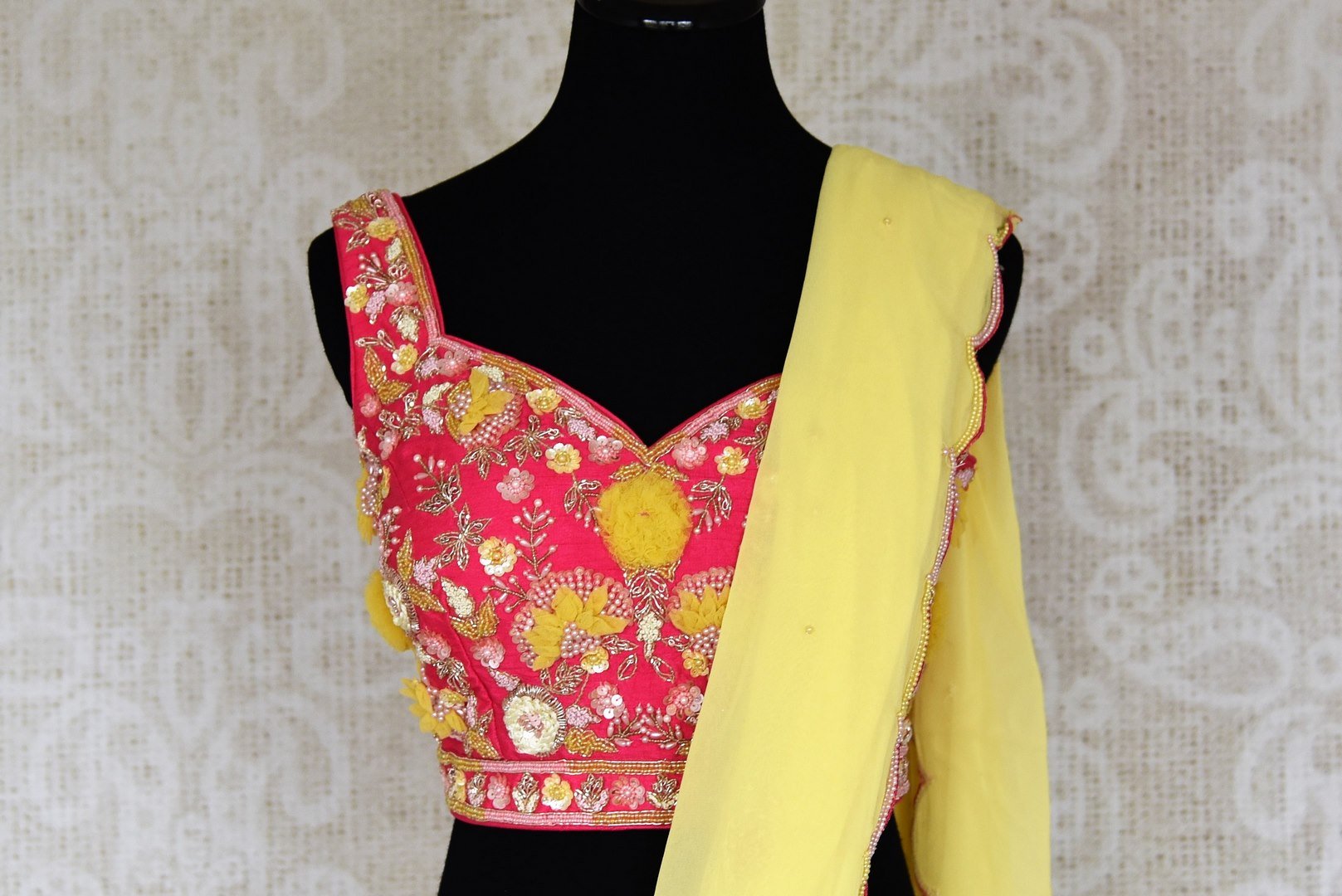 Buy beautiful lemon yellow embroidered georgette saree online in USA with pink embroidered blouse. Look your best at weddings and parties in Indian sarees, designer saris, printed sarees, embroidered sarees from Pure Elegance Indian fashion store in USA.-closeup