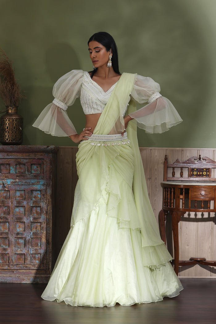 Buy beautiful mint green contemporary lehenga online in USA with draped dupatta. Look your best at weddings and parties in Indian dresses, designer lehengas, Anarkali suits, designer gowns, salwar suits, sharara suits from Pure Elegance Indian fashion store in USA.-full view