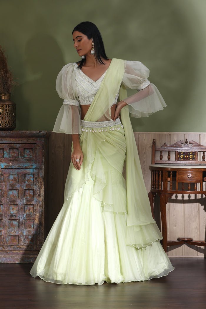 Buy beautiful mint green contemporary lehenga online in USA with draped dupatta. Look your best at weddings and parties in Indian dresses, designer lehengas, Anarkali suits, designer gowns, salwar suits, sharara suits from Pure Elegance Indian fashion store in USA.-side