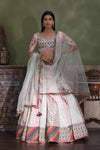 Buy beautiful white embroidered lehenga online in USA with multicolor border and dupatta. Look your best at weddings and parties in Indian dresses, designer lehengas, Anarkali suits, designer gowns, salwar suits, sharara suits from Pure Elegance Indian fashion store in USA.-full view