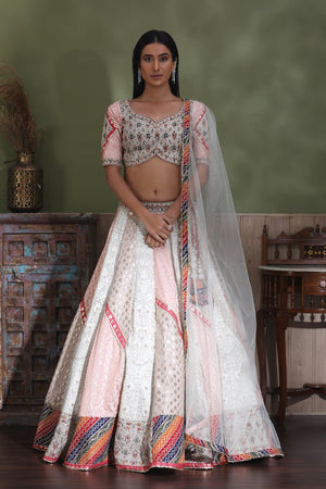 Buy beautiful white embroidered lehenga online in USA with multicolor border and dupatta. Look your best at weddings and parties in Indian dresses, designer lehengas, Anarkali suits, designer gowns, salwar suits, sharara suits from Pure Elegance Indian fashion store in USA.-front