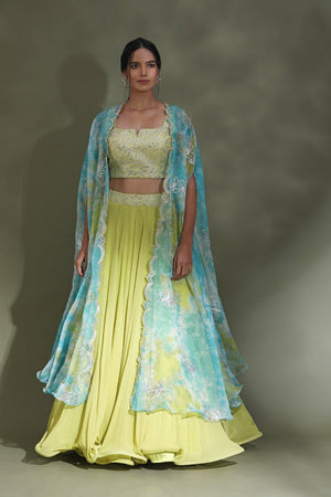 Shop beautiful bright yellow designer lehenga online in USA with blue dupatta. Look your best at weddings and parties in Indian dresses, designer lehengas, Anarkali suits, designer gowns, salwar suits, sharara suits from Pure Elegance Indian fashion store in USA.-side