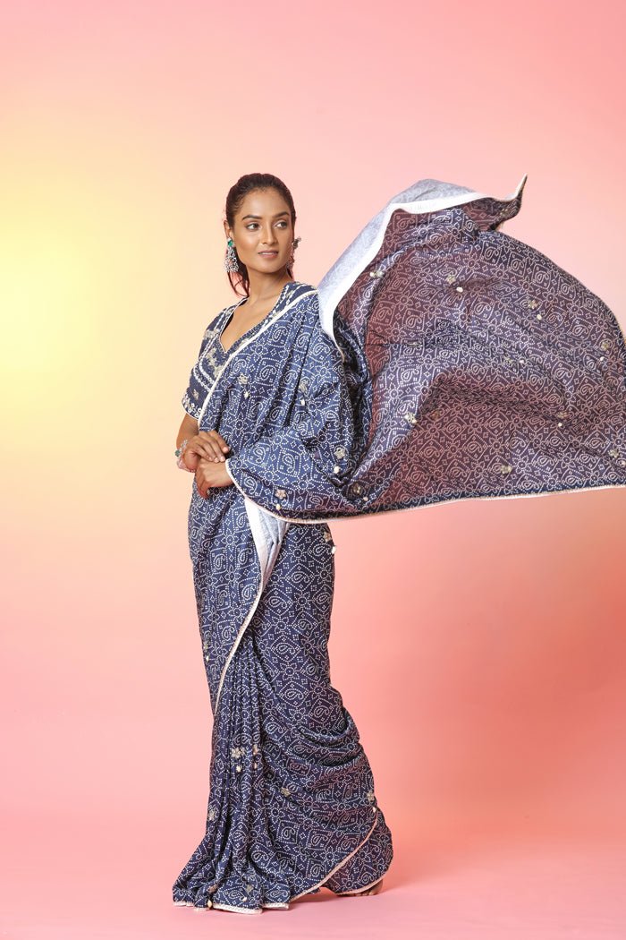 Shop stunning blue bandhej mirror work saree online in USA with mirror work blouse. Look your best at weddings and parties in Indian dresses, designer lehengas, Anarkali suits, designer gowns, salwar suits, sharara suits, embroidered sarees, designer sarees from Pure Elegance Indian fashion store in USA.-side