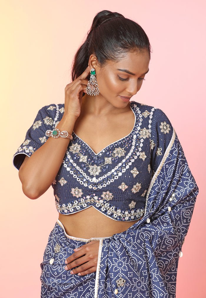 Shop stunning blue bandhej mirror work saree online in USA with mirror work blouse. Look your best at weddings and parties in Indian dresses, designer lehengas, Anarkali suits, designer gowns, salwar suits, sharara suits, embroidered sarees, designer sarees from Pure Elegance Indian fashion store in USA.-closeup
