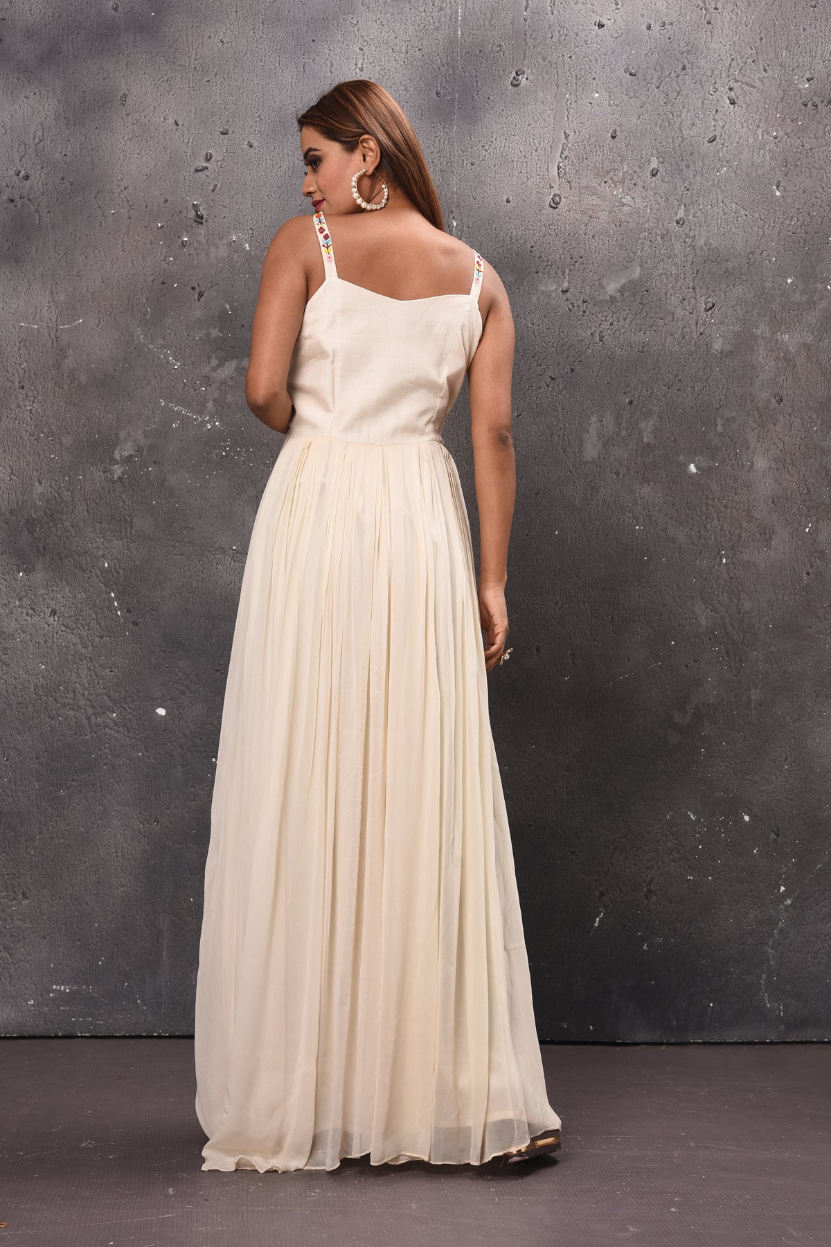 Shop stunning cream maxi dress online in USA with embroidered bodice. Get set for weddings and festive occasions in exclusive designer Anarkali suits, wedding gown, salwar suits, gharara suits, Indowestern dresses from Pure Elegance Indian fashion store in USA.-back