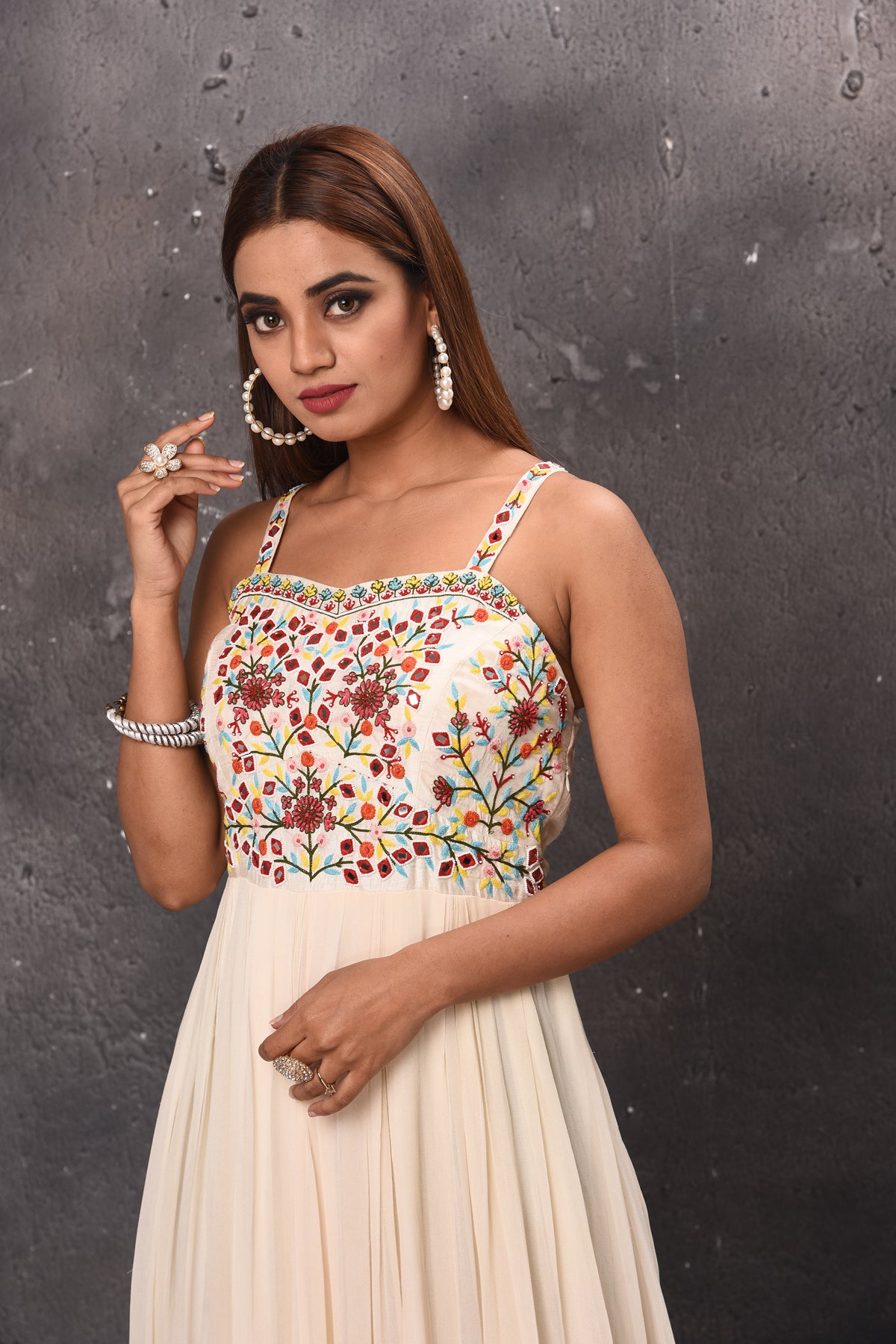 Shop stunning cream maxi dress online in USA with embroidered bodice. Get set for weddings and festive occasions in exclusive designer Anarkali suits, wedding gown, salwar suits, gharara suits, Indowestern dresses from Pure Elegance Indian fashion store in USA.-closeup