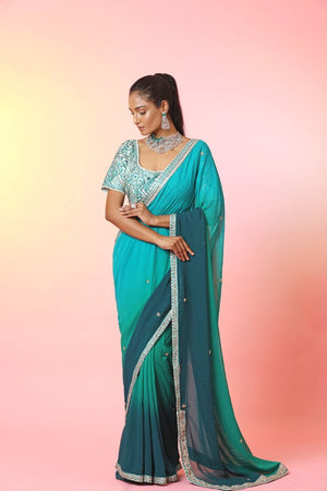 Shop beautiful ombre green designer saree online in USA with embroidered blouse. Look your best at weddings and parties in Indian dresses, designer lehengas, Anarkali suits, designer gowns, salwar suits, sharara suits, embroidered sarees, designer sarees from Pure Elegance Indian fashion store in USA.-front