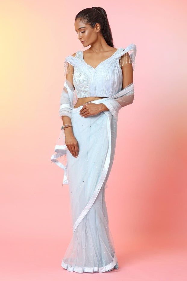 Buy beautiful white designer saree online in USA with sculpted saree blouse. Look your best at weddings and parties in Indian dresses, designer lehengas, Anarkali suits, designer gowns, salwar suits, sharara suits, embroidered sarees, designer sarees from Pure Elegance Indian fashion store in USA.-full view